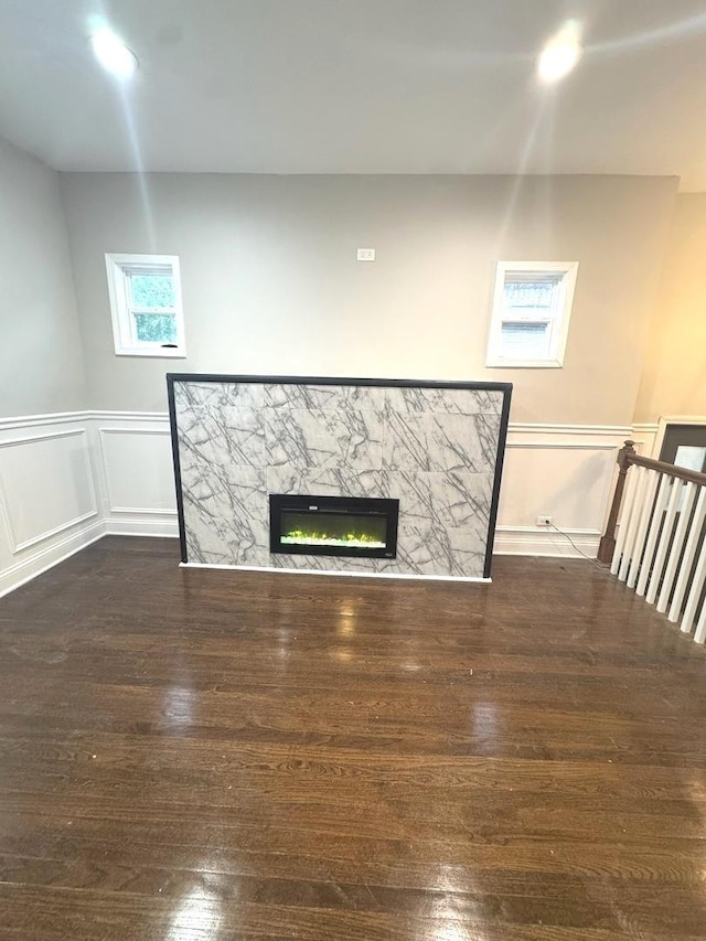 9432 S Vernon Ave, Chicago, IL 60619 - detailed view of wood finished floors, a glass covered fireplace, wainscoting, and a decorative wall