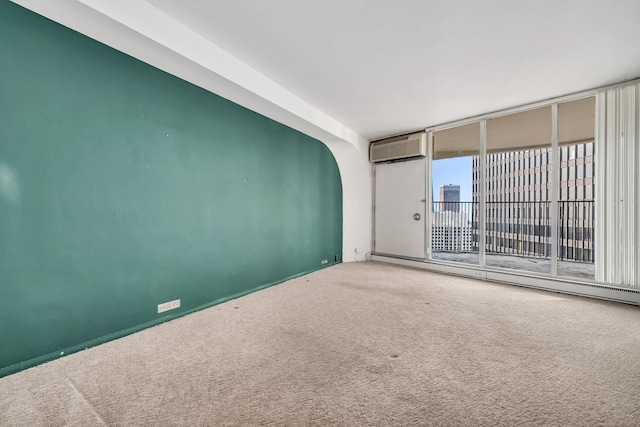300 N State St Unit 5320, Chicago, IL 60654 - carpeted spare room featuring an AC wall unit, a baseboard radiator, and arched walkways