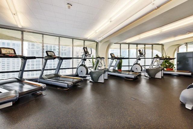 300 N State St Unit 5320, Chicago, IL 60654 - gym with expansive windows, healthy amount of natural light, and arched walkways