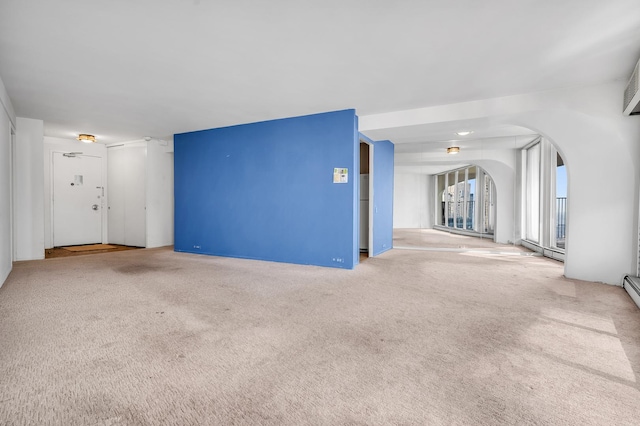 300 N State St Unit 5320, Chicago, IL 60654 - unfurnished living room with arched walkways and carpet
