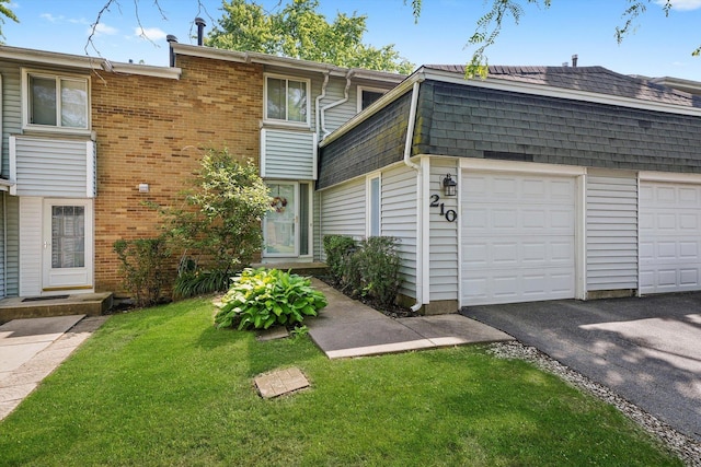 210 Diane Ln, Bolingbrook, IL 60440 - view of front of property with driveway, a front yard, a garage, and roof with shingles