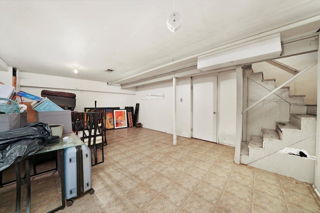 210 Diane Ln, Bolingbrook, IL 60440 - finished below grade area with tile patterned floors and stairway