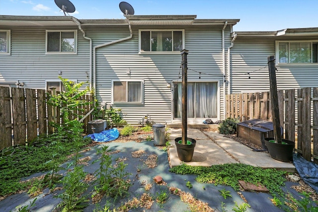 210 Diane Ln, Bolingbrook, IL 60440 - rear view of house featuring a patio and a fenced backyard
