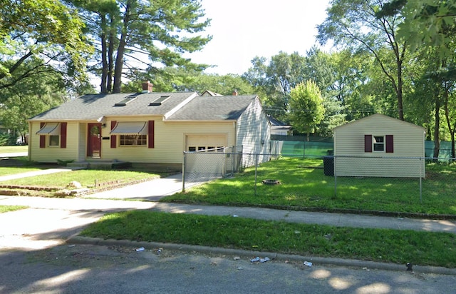 2928 Garfield Dr, Rockford, IL 61101 - ranch-style home with an attached garage, a chimney, driveway, and view of wooded area