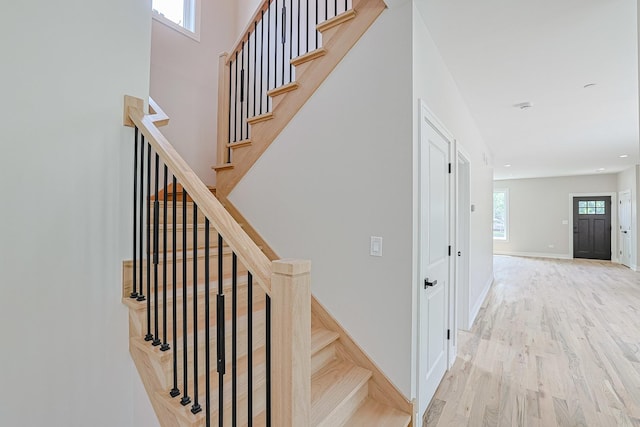 7948 W 74th Ave, Bridgeview, IL 60455 - stairs with wood finished floors and recessed lighting