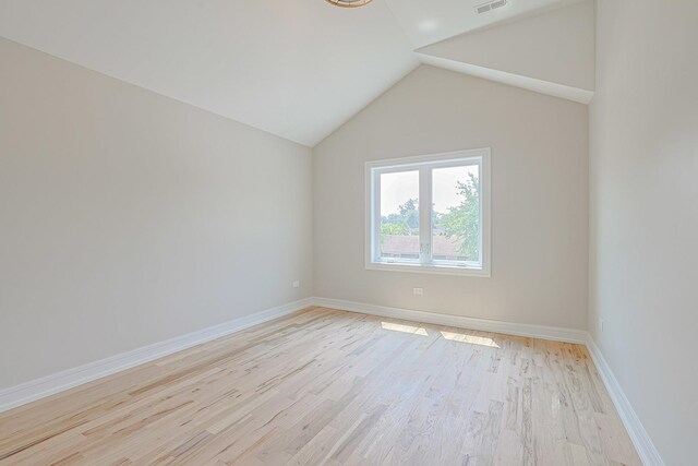 7948 W 74th Ave, Bridgeview, IL 60455 - additional living space featuring light wood-style flooring and lofted ceiling