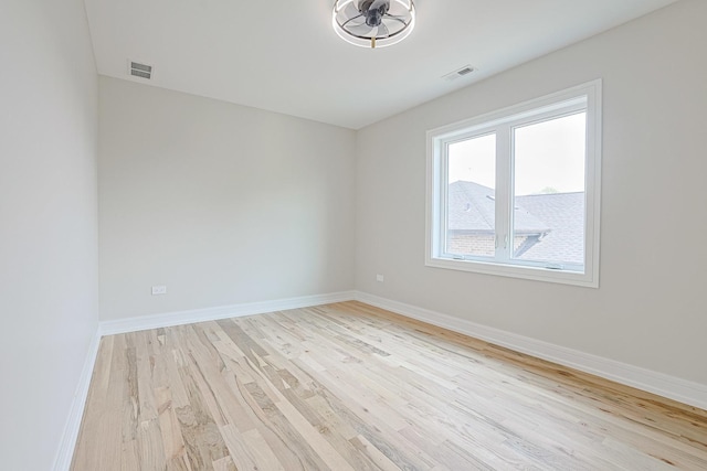 7948 W 74th Ave, Bridgeview, IL 60455 - unfurnished room with wood finished floors and baseboards