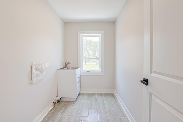 7948 W 74th Ave, Bridgeview, IL 60455 - washroom featuring a sink and wood tiled floors