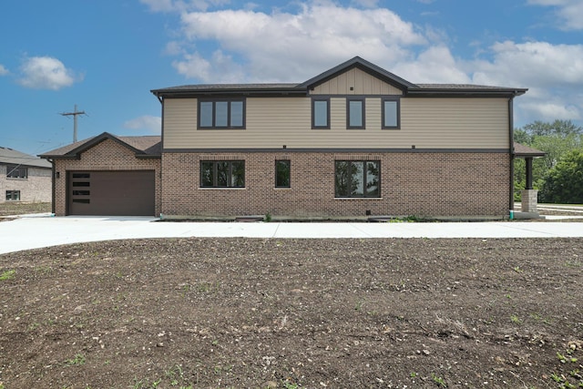 7948 W 74th Ave, Bridgeview, IL 60455 - view of side of home with driveway, brick siding, a garage, and board and batten siding