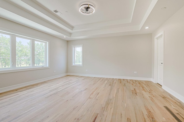 7948 W 74th Ave, Bridgeview, IL 60455 - empty room with a tray ceiling, light wood-style floors, and recessed lighting