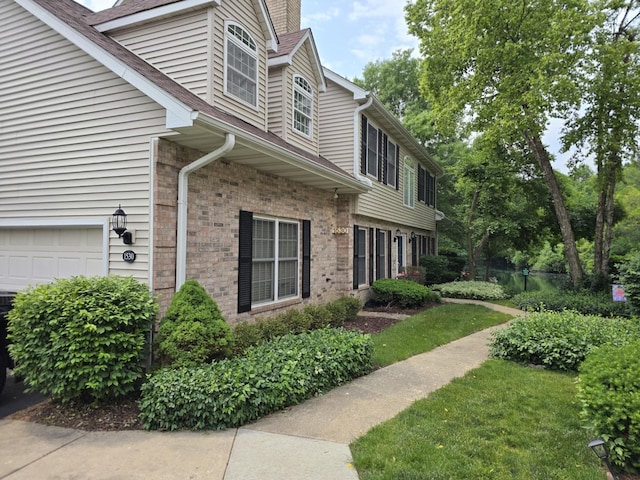 1530 Laurel Oaks Dr, Streamwood, IL 60107 - view of property exterior featuring brick siding and a chimney