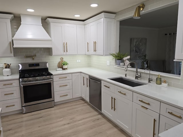 1530 Laurel Oaks Dr, Streamwood, IL 60107 - kitchen featuring appliances with stainless steel finishes, premium range hood, white cabinets, tasteful backsplash, and light countertops