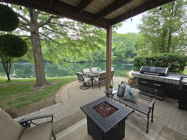 1530 Laurel Oaks Dr, Streamwood, IL 60107 - view of patio / terrace featuring outdoor dining area, a fire pit, a water view, grilling area, and a view of trees