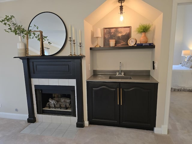 1530 Laurel Oaks Dr, Streamwood, IL 60107 - detailed view of carpet, bar with sink, and a tiled fireplace