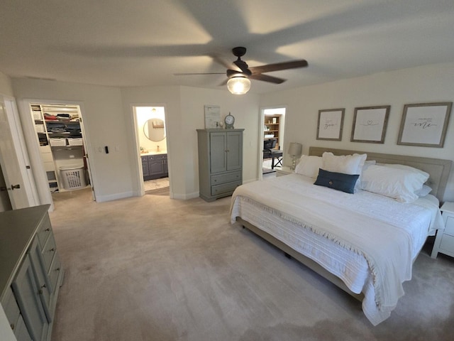 1530 Laurel Oaks Dr, Streamwood, IL 60107 - bedroom featuring light colored carpet, a spacious closet, ceiling fan, connected bathroom, and a closet