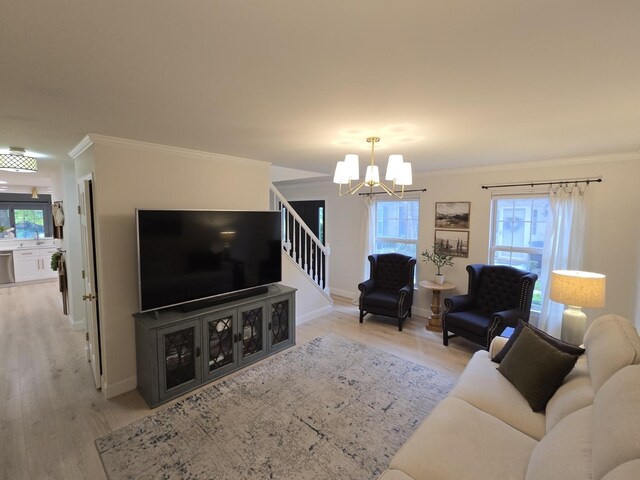 1530 Laurel Oaks Dr, Streamwood, IL 60107 - living room featuring a chandelier, stairs, light wood-type flooring, and ornamental molding