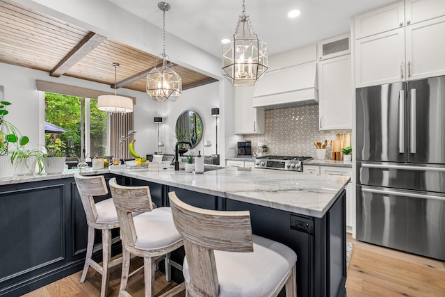 638 Legend Ln, Mchenry, IL 60050 - kitchen featuring freestanding refrigerator, a chandelier, a wooden ceiling with exposed beams, custom range hood, and a breakfast bar