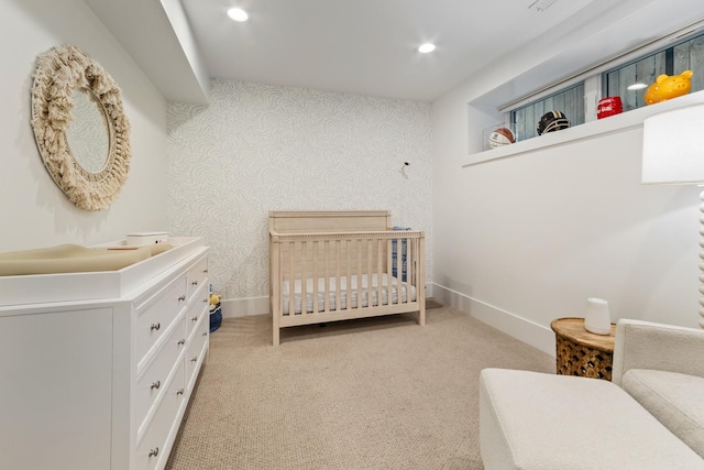 1304 N Hoyne Ave Unit 1, Chicago, IL 60622 - bedroom with a nursery area, light carpet, recessed lighting, and wallpapered walls
