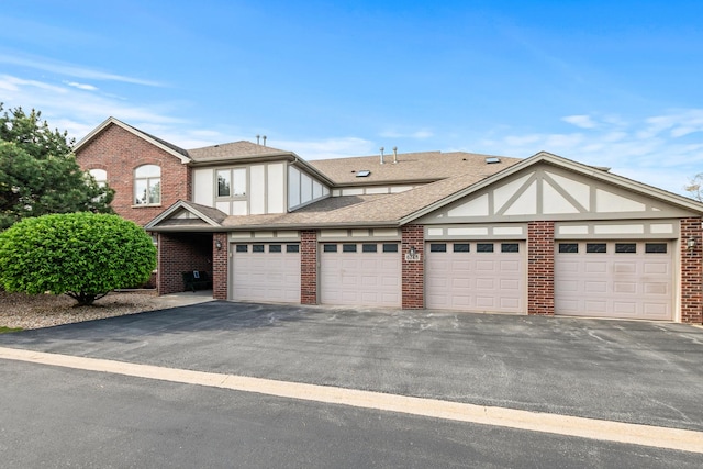 6248 Misty Pines Dr Unit 4, Tinley Park, IL 60477 - view of front facade featuring brick siding, driveway, and roof with shingles
