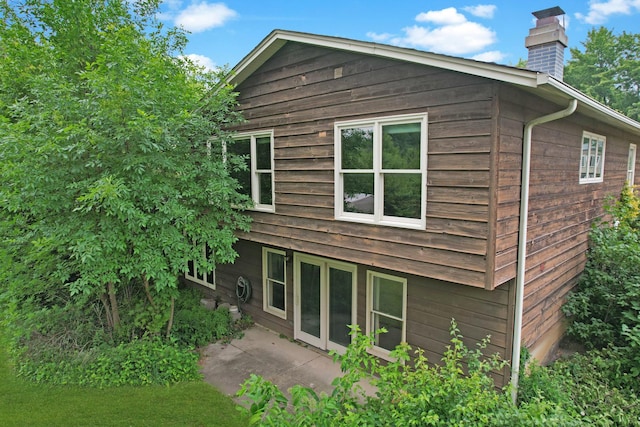 198 S Circle Ave, Bloomingdale, IL 60108 - rear view of property with a chimney and a patio