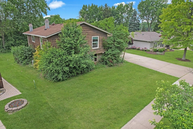 198 S Circle Ave, Bloomingdale, IL 60108 - view of side of property with a chimney, a yard, and driveway