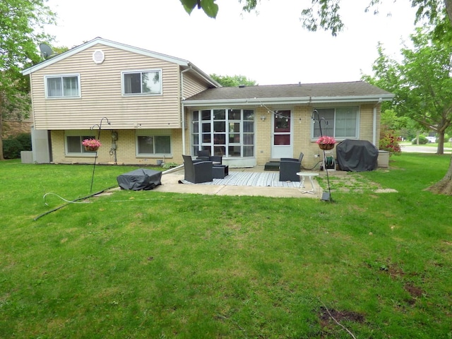 1420 E Lake Louise Dr, Palatine, IL 60074 - back of property with a patio area, brick siding, and a lawn