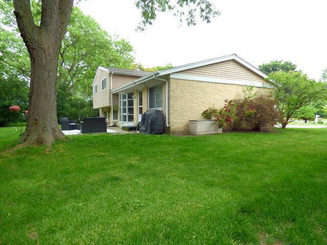 1420 E Lake Louise Dr, Palatine, IL 60074 - view of home's exterior with brick siding and a yard