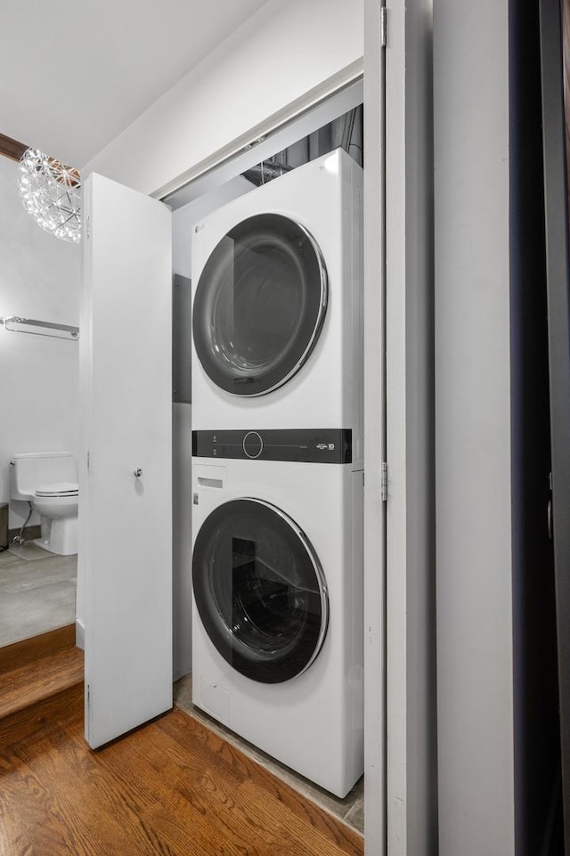 400 S Green St Unit 406, Chicago, IL 60607 - laundry area featuring estacked washer and dryer and wood finished floors