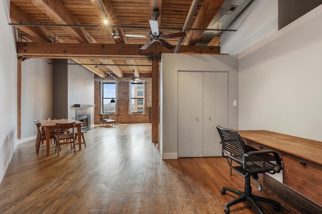 400 S Green St Unit 406, Chicago, IL 60607 - office featuring a wood ceiling with exposed beams, wood finished floors, ceiling fan, and a fireplace