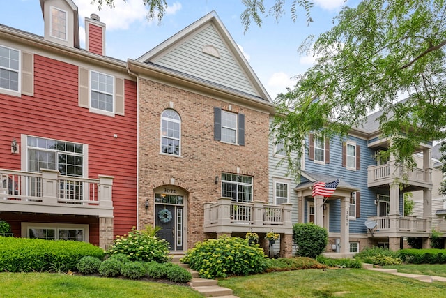 3072 Bridgeham St, Elgin, IL 60124 - view of property featuring brick siding and a chimney
