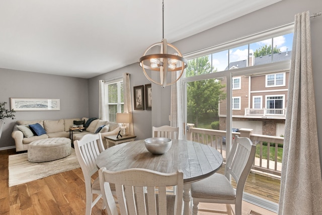 3072 Bridgeham St, Elgin, IL 60124 - dining space featuring wood finished floors and a chandelier