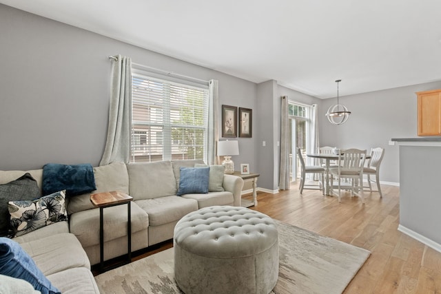 3072 Bridgeham St, Elgin, IL 60124 - living area featuring light wood-type flooring and a chandelier