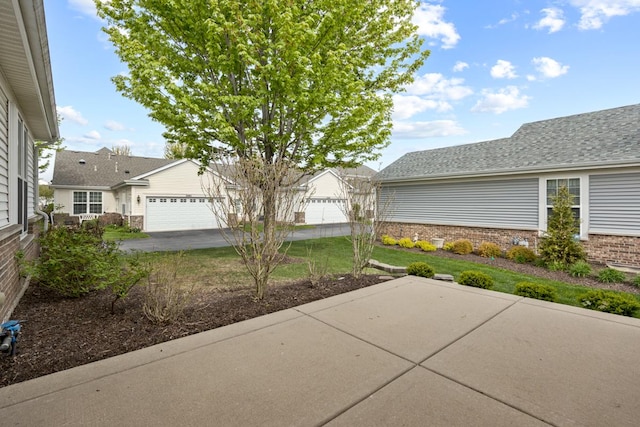 2929 Portage St, Naperville, IL 60564 - view of patio / terrace with an attached garage and concrete driveway