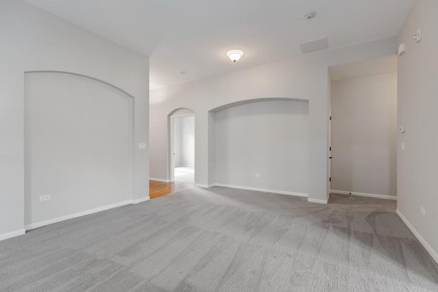 2929 Portage St, Naperville, IL 60564 - carpeted spare room featuring arched walkways and baseboards