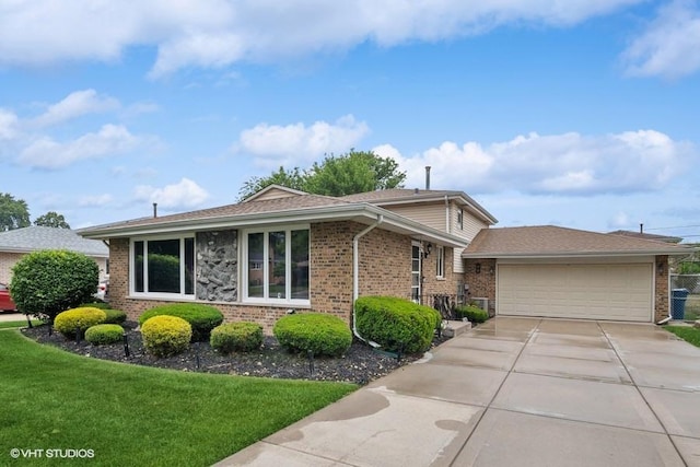 9133 Moody Ave, Oak Lawn, IL 60453 - view of front facade with brick siding, a front lawn, driveway, and a shingled roof