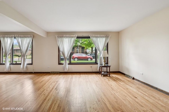 9133 Moody Ave, Oak Lawn, IL 60453 - unfurnished room featuring wood finished floors and healthy amount of natural light
