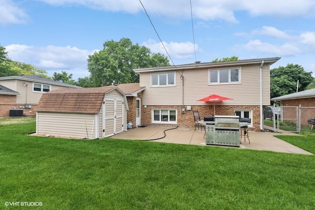 9133 Moody Ave, Oak Lawn, IL 60453 - back of house with a storage unit, a gate, a patio area, and brick siding