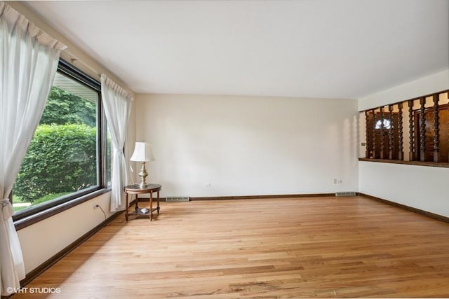 9133 Moody Ave, Oak Lawn, IL 60453 - spare room featuring wood finished floors and baseboards
