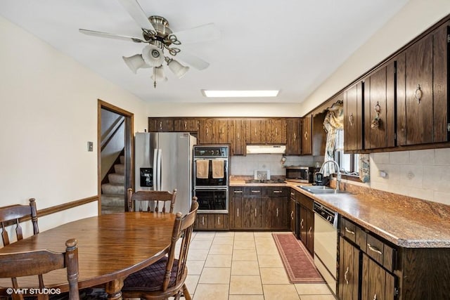 9133 Moody Ave, Oak Lawn, IL 60453 - kitchen featuring appliances with stainless steel finishes, tasteful backsplash, under cabinet range hood, and dark brown cabinetry