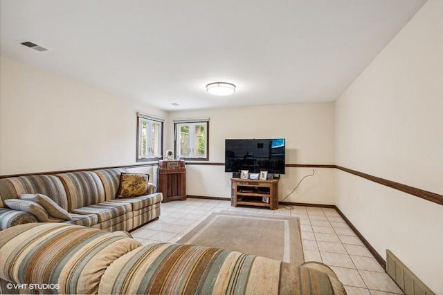 9133 Moody Ave, Oak Lawn, IL 60453 - living room featuring light tile patterned flooring and baseboards