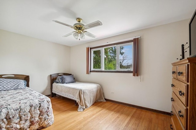 9133 Moody Ave, Oak Lawn, IL 60453 - bedroom with light wood-type flooring and a ceiling fan