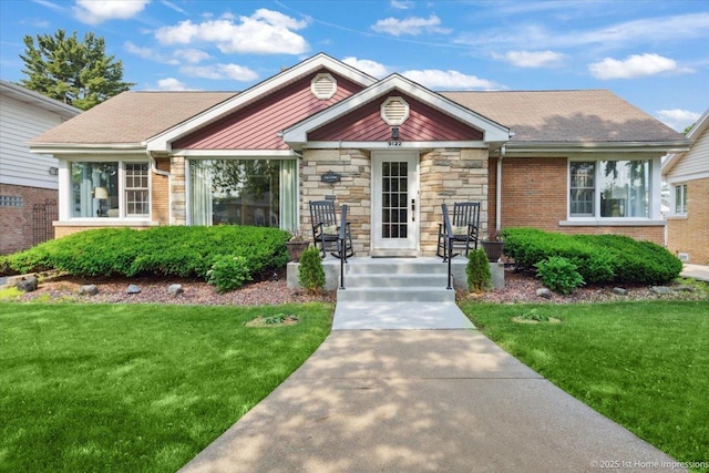 9122 S Avers Ave, Evergreen Park, IL 60805 - view of front facade with a front yard, brick siding, and stone siding