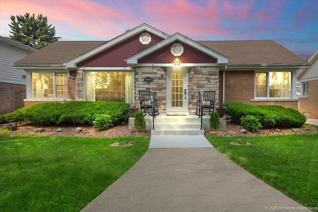 9122 S Avers Ave, Evergreen Park, IL 60805 - view of front of property featuring a lawn, brick siding, and covered porch