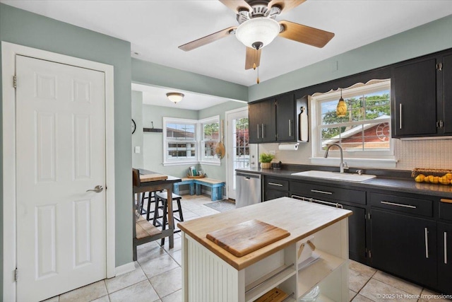 9122 S Avers Ave, Evergreen Park, IL 60805 - kitchen featuring stainless steel dishwasher, dark cabinetry, backsplash, and light tile patterned floors