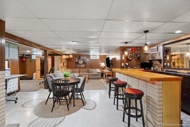 9122 S Avers Ave, Evergreen Park, IL 60805 - dining space with a dry bar, wood walls, and a paneled ceiling