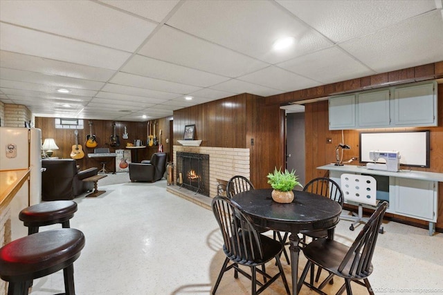 9122 S Avers Ave, Evergreen Park, IL 60805 - dining space featuring a drop ceiling, wood walls, a fireplace, and an office area