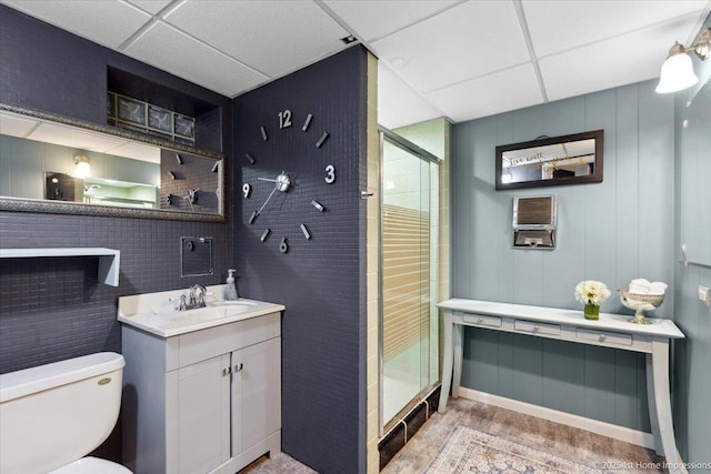 9122 S Avers Ave, Evergreen Park, IL 60805 - full bath featuring a drop ceiling, a shower stall, vanity, and wood finished floors