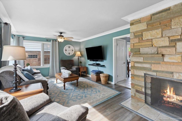 9122 S Avers Ave, Evergreen Park, IL 60805 - living room featuring a stone fireplace, crown molding, a ceiling fan, and wood finished floors