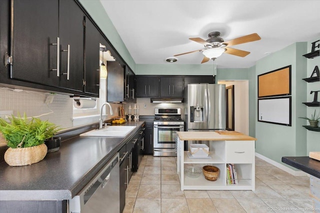 9122 S Avers Ave, Evergreen Park, IL 60805 - kitchen featuring appliances with stainless steel finishes, open shelves, ceiling fan, under cabinet range hood, and backsplash