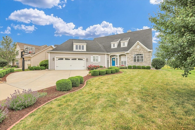 2955 E Stone Creek Blvd, Urbana, IL 61802 - view of front of property with driveway, stone siding, a front yard, and a garage